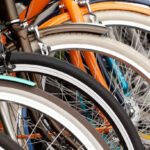 bicycle wheels standing in a row in a warehouse or in a store